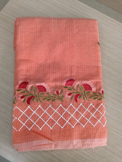 Orange Kota Saree with pink floral embroidery