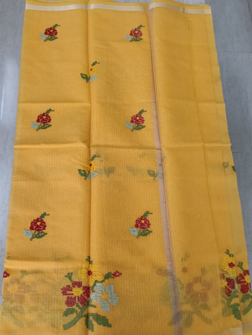 Yellow Kota Saree with embrioded floral motifs